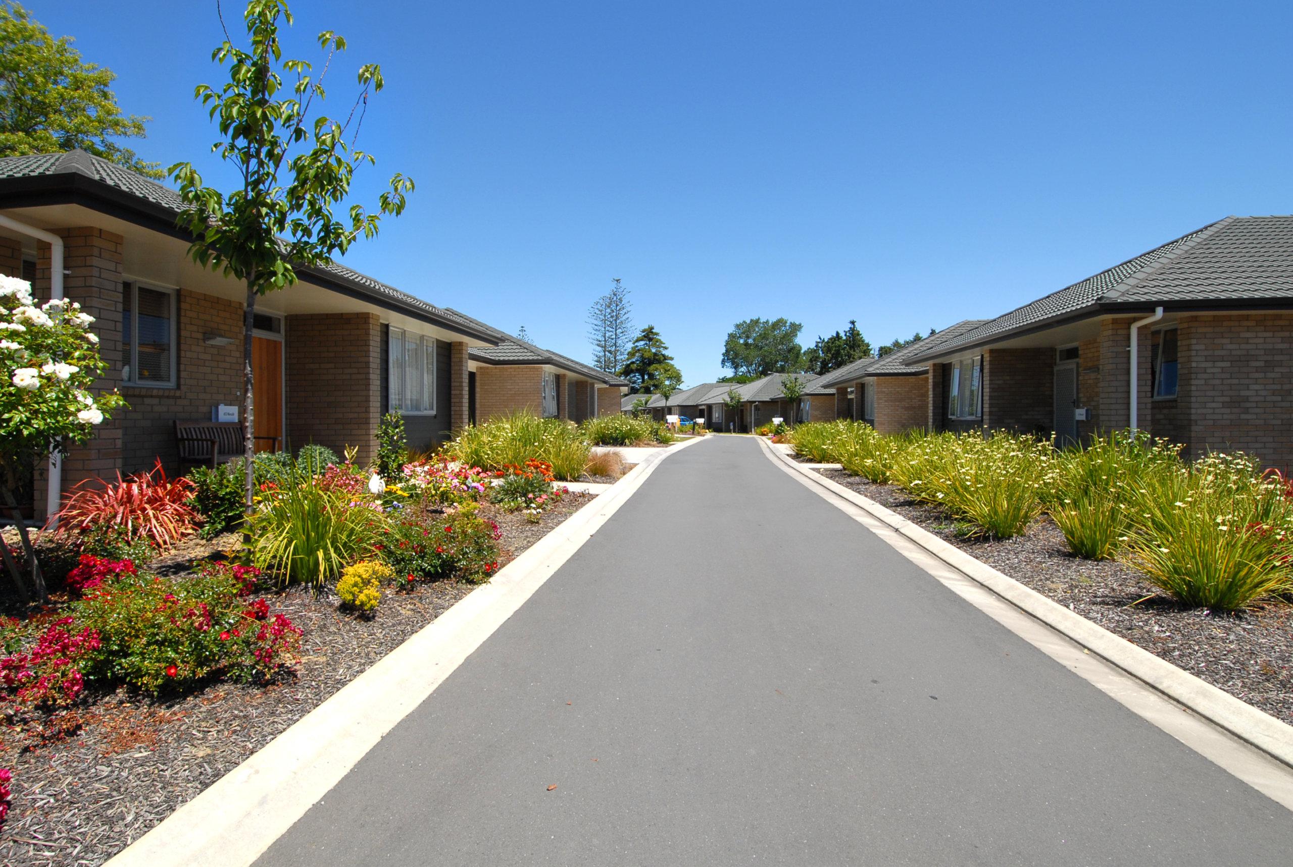 Elmwood driveway with flower beds