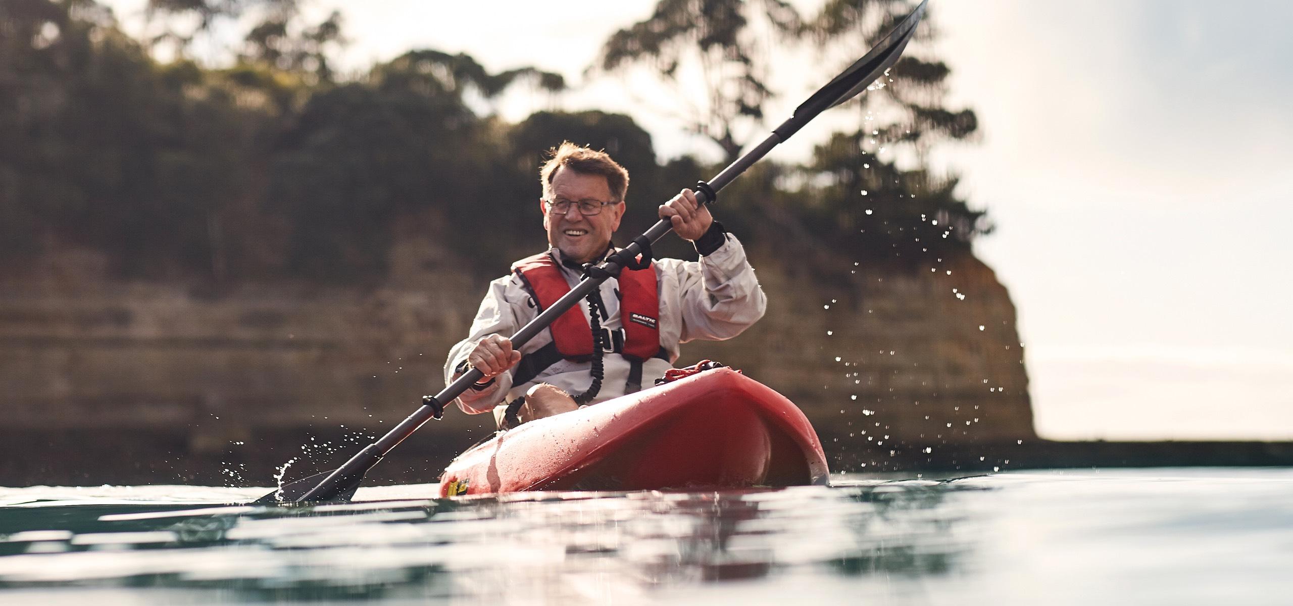 Oceania resident enjoying ocean kayaking